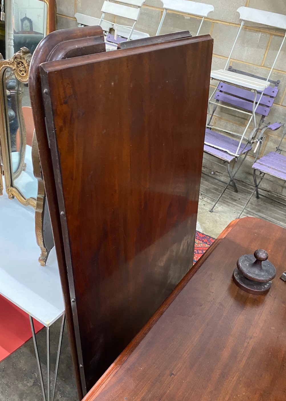 A Victorian mahogany twin pillar dining table, in need of restoration, length 203cm, width 138cm, height 75cm